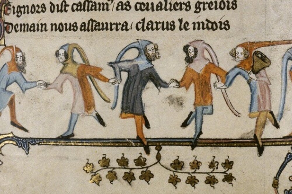 hooded figures dancing