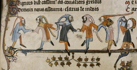 hooded figures dancing