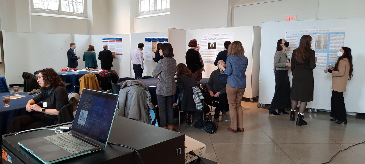 Attendees perusing the posters for the research fair.